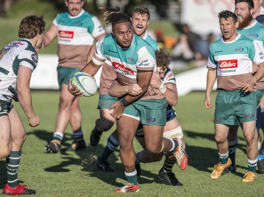 TOUGH DAY: Hunter Wildfires coach Taulogo Lalaga looks to offload in the 50-15 defeat to Warringah at No.2 Sportsground on Saturday. Picture: Stewart Hazell