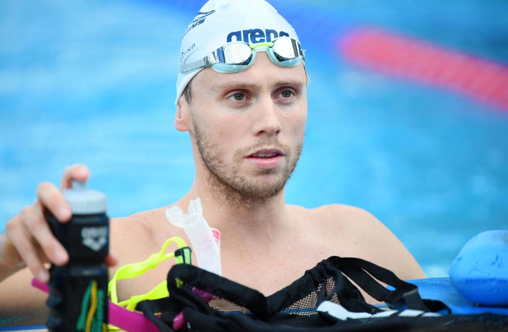FOCUSED: Thomas Fraser-Holmes takes a breather at the Australian Dolphins swim team training camp in Cairn. Picture: Delly Carr
