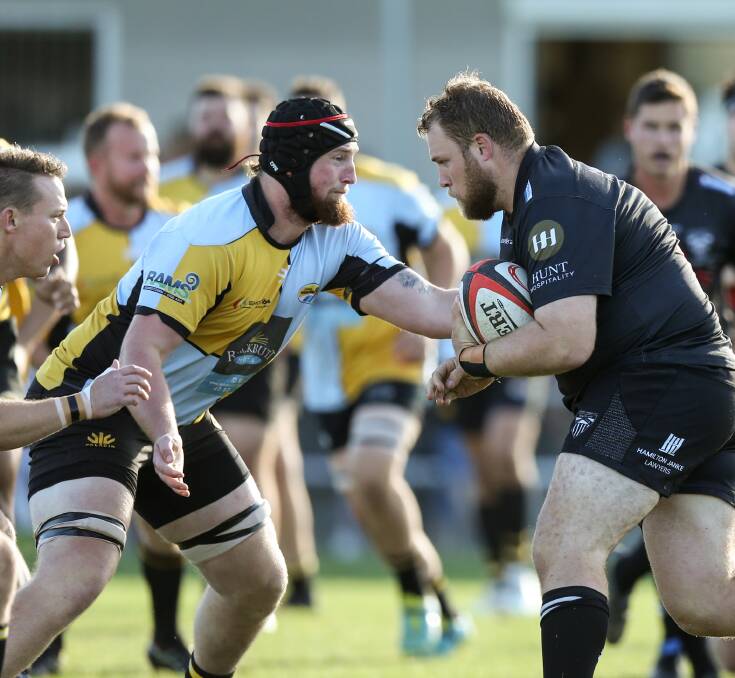 FRONT LINE: Kiwi lock Lucas Rosewall makes a tackle on Maitland prop Harry Chapman in Southern Beaches' win on Saturday. Picture: Marina Neil