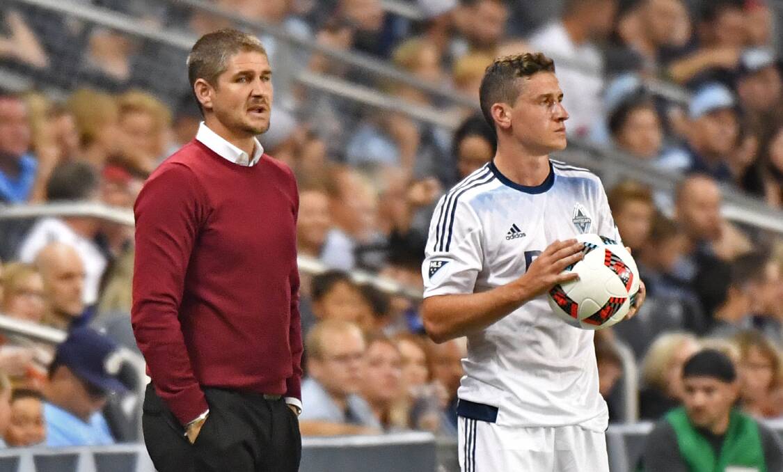 IN CONTENTION: Carl Robinson gives instructions to Vancouver Whitecaps defender Fraser Aird during a US Major Soccer League clash. Picture: Getty Images