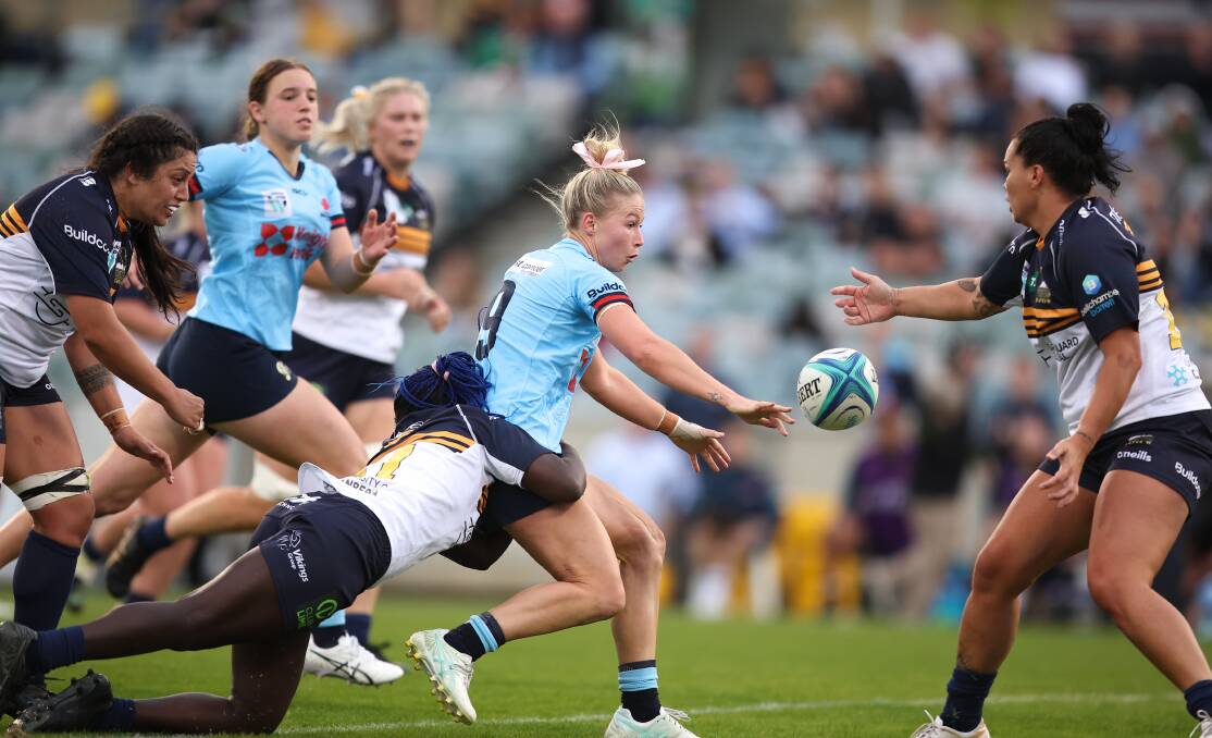 Layne Morgan gets a pass away playing for NSW Waratahs against the ACT Brumbies. Picture by Sitthixay Ditthavong