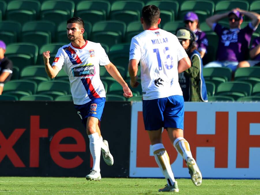FIRED UP: Steve Ugarkovic tries to rev up the Jets after scoring a goal in the 6-2 loss to Perth Glory on Sunday. The Jets meet fellow strugglers Brisbane at home on Saturday. Picture: Getty Images