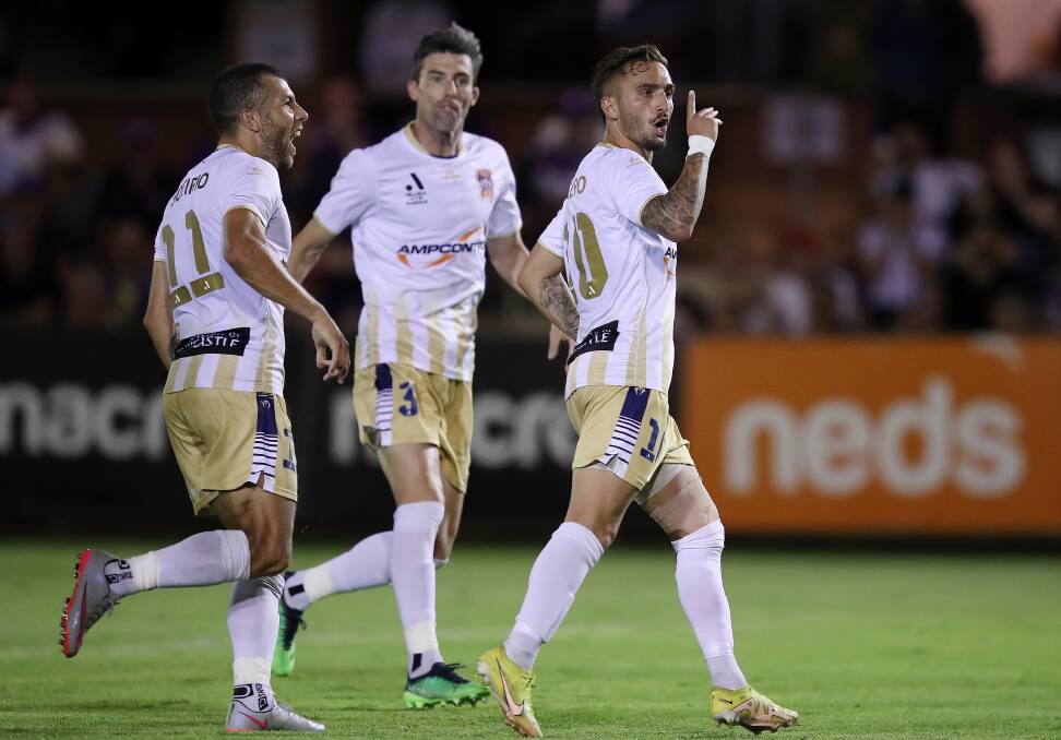 Midfielder Reno Piscopo celebrates after scoring the Jets' first goal in a 2-all draw with Perth Glory at Macedonia Park on Saturday night. Picture Getty Images
