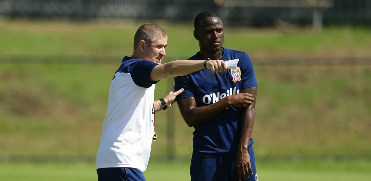 SUPPORT NETWORK: Jets coach Carl Robinson and Panamanian striker Abdiel Arroyo. Picture: Jonathan Carroll 