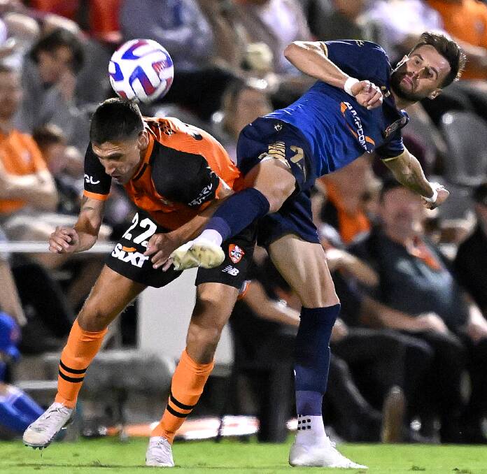 Brisbane striker Stefan epovi and jets defender Carl Jenkinson battle for possiession in the Roar's 3-0 win at Kayo Stadium on Saturday night. Picture Getty Images
