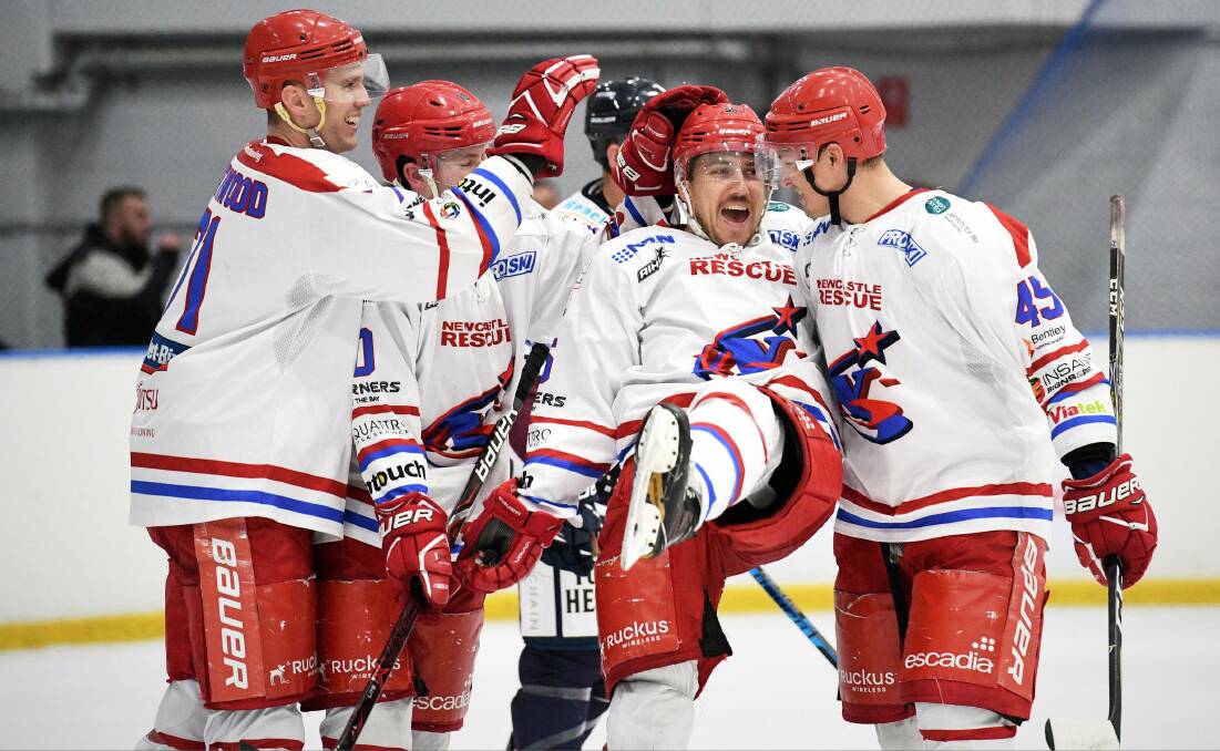 All SMILES: Richie Tesarik (second from right) scored a goal as the Newcastle Northstars came from behind to beat the Sydney Ice Dogs in a shootout on Sunday night and seal a place in the play-offs. Picture: PowerPlay Photographics