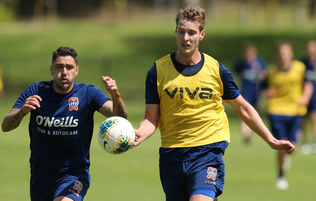 FOCUSED: Lachy Jackson competes with Dimi Petratos for possession at training. Picture: Max Mason-Hubers