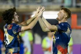 Newcastle Jets centre-backs mark Natta and Phil Cancar. Picture Getty Images