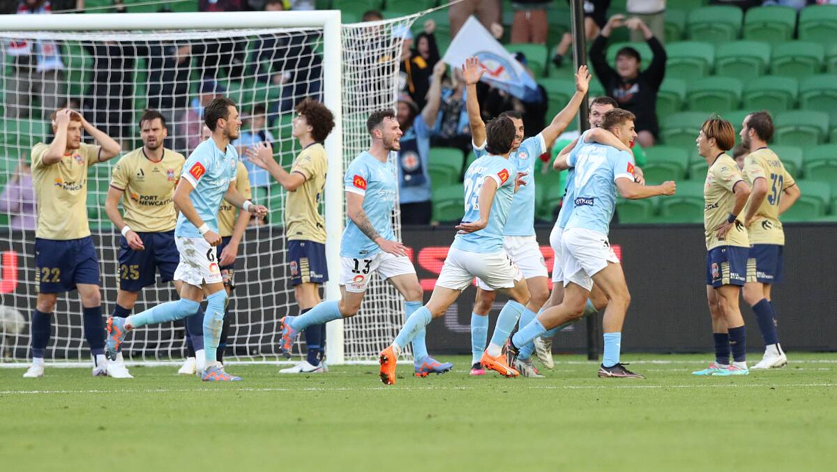 Melbourne City celebrate after max Caputo scored an equaliser in injury time for a 1-all draw with the Newcastle Jets at AAMI Park on Sunday. Picture Getty Images