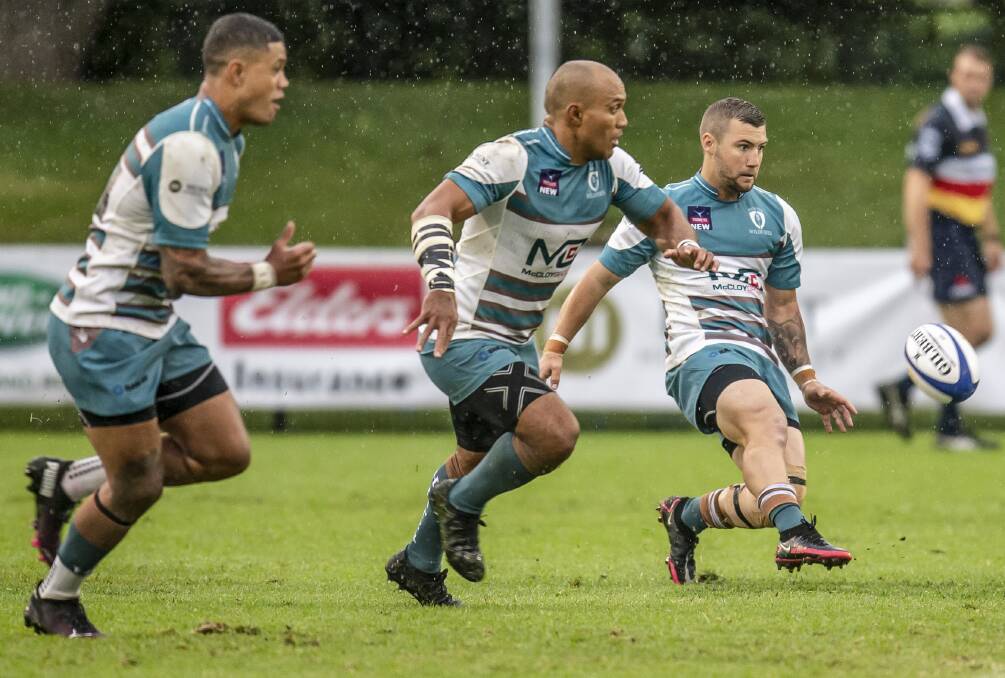 SHUFFLE: Jayden Wright kicks ahead for outside men Carl Manu and Nate De Thierry. Wright moves to fullback in a rejigged Wildfires backline for the clash against Randwick at No.2 Sportsground on Saturday. Picture: Stewart Hazell 