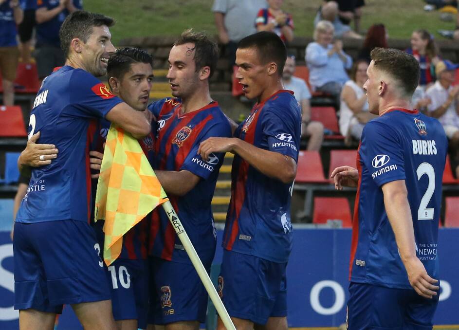 GOAL TIME: Teammates congratulate Dimi Petratos (second from left) after he put the Jets ahead in the 1-all draw with Brisbane. Picture: Getty Images