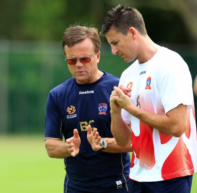 IN TUNE: Jets coach Branko Culina and former English Premier League striker Michael Bridges trade ideas at training. Picture: Ryan Osland