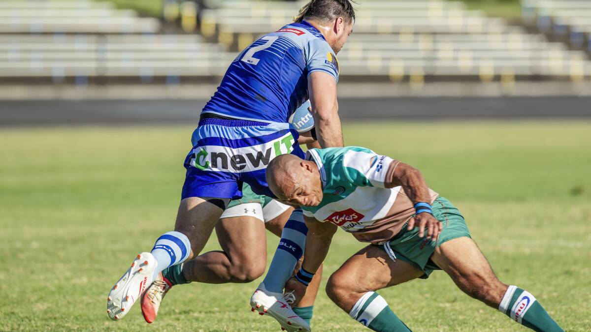 CRUNCH: Carl Manu broke his right arm attempting a tackle on Western Sydney centre and former Parramatta Eel Tepai Moeroa. Picture: Stewart Hazell 