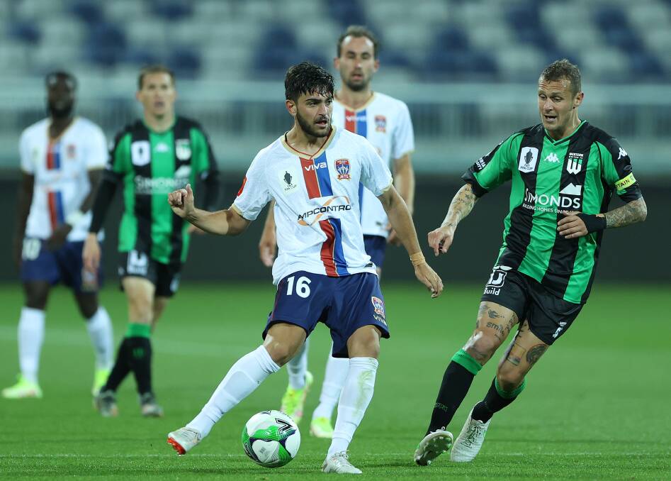 ON THE BALL: Midfielder Kosta Grozos plays a pass in the Jets' 2-1 loss to Western United on Saturday night. Picture: Getty Images 