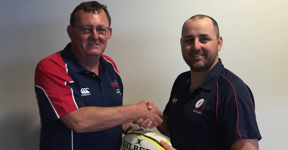 HELPING HAND: Newcastle Hunter Rugby Union President Paul Coles and Hunter Juniors President Marcus Vaughan have signed off on a new age structure.