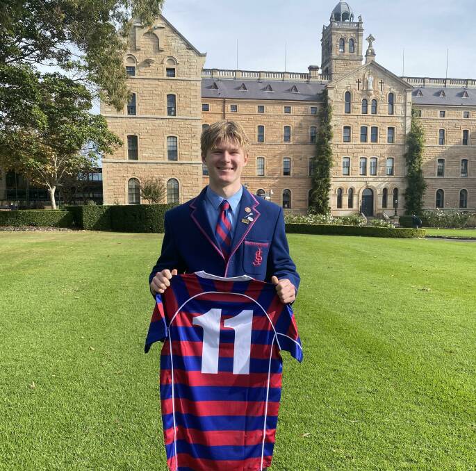 Max McGavern at St Joseph's College with his playing jumper. Picture Supplied