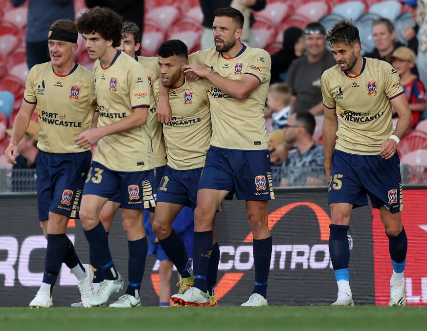 Jaushua Sotirio is congratulated by teammates after he set up Beka Mikeltadze's match winner against Perth. Picture Getty Images