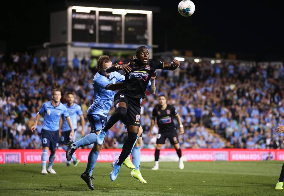 STRUGGLE: Adbiel Arroyo flies high for a head in the Jets' 4-1 loss to Sydney FC at Leichhardt Oval on Friday night. Picture: Getty Images