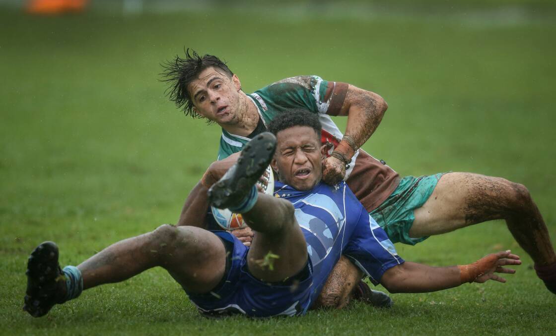 COLLARED: Hunter Wildfires' halfback Nick Murray brings a Western Sydney player to ground in the semi-final of the Mick 'Whale' Curry Memorial Sevens at St John Oval on Saturday. Murray is a among five halfbacks in the Wildfires squad. Pictures: Marina Neil 