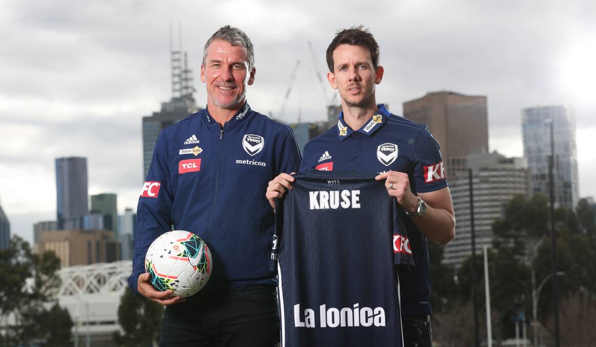 NEW HOME: New Melbourne Victory coach Marco Kurz and injured attacker Robbue Kruse. Picture: AAP