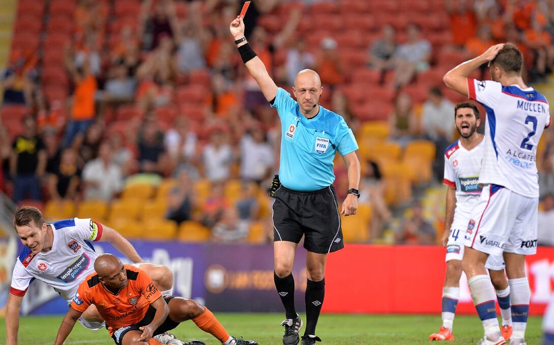 BIG CALL: Referee Strebre Delovski issues a red card to Jets skipper Nigel Boogaard. Picture: Getty Images