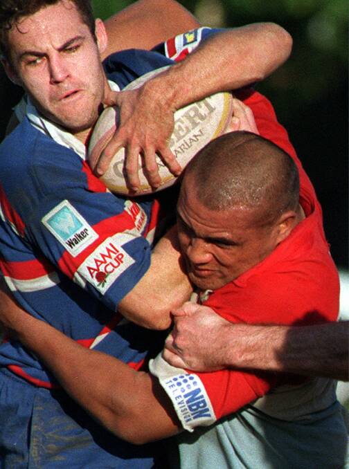 TURNING BACK THE CLOCK: Marty Lisiua monsters an Eastern Suburbs player during a Shute Shield game in 1997. Picture: Peter Stoop 