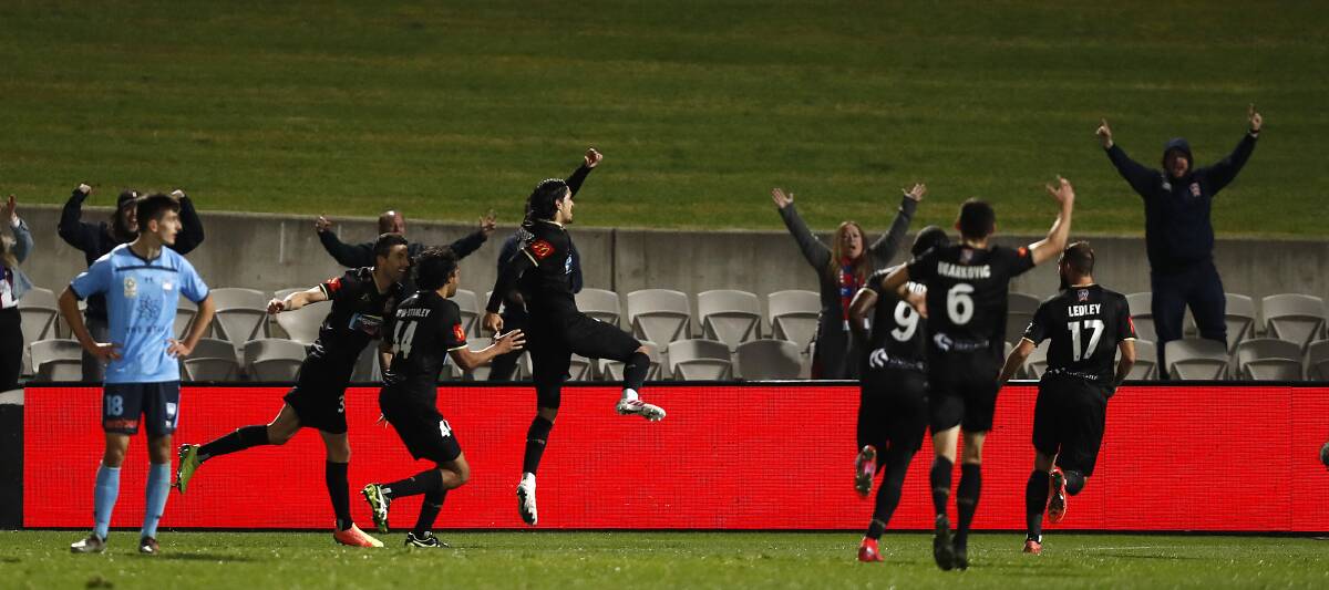 STAYING ALIVE: The Jets celebrate Kosta Petratos' matchwinner against Sydney FC. Picture: Getty Images