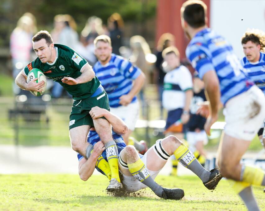 FRONT FOOT: Merewether inside centre Will Frost set up a try for captain Sam Rouse in the Greens' 19-7 win over Wanderers at Townson Oval on Saturday. Picture: Jonathan Carroll