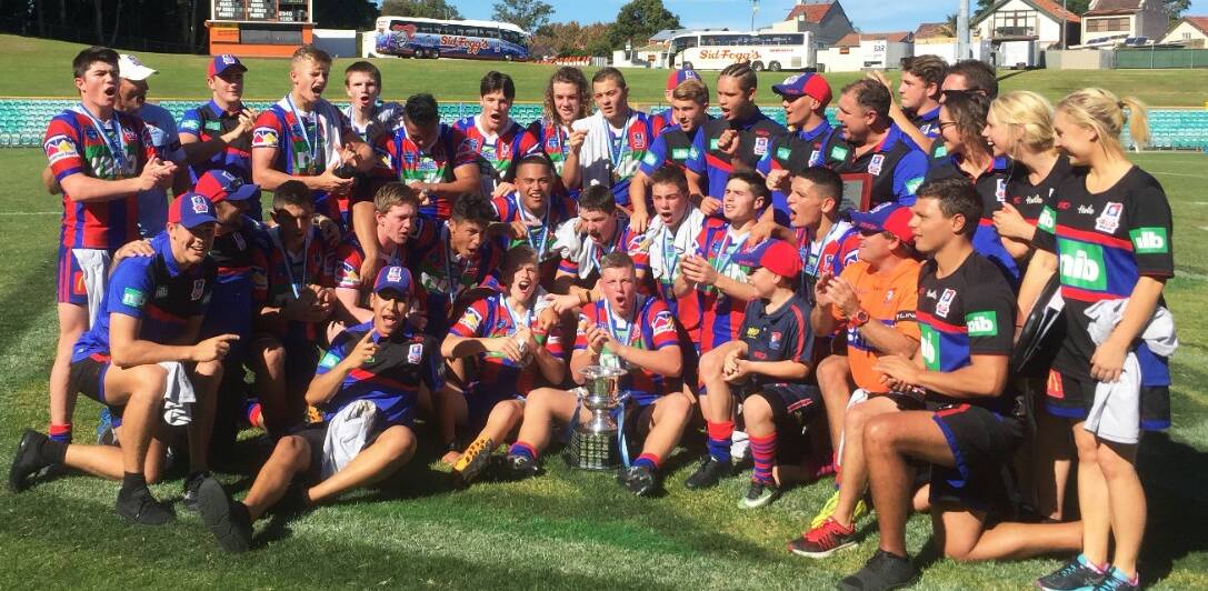 CHAMPIONS: Knights under-16s players and coaching staff celebrate after beating Manly to win the Harold Matthews Cup final at Leichhardt Oval on Saturday. Picture: Newcastle Knights 