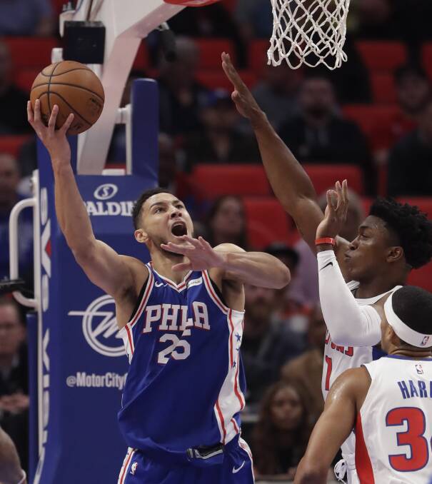 ON FIRE: Ben Simmons shoots over the top of Detroit Pistons forward Stanley Johnson during the 76ers' 97-86 win on Tuesday. Picture: AP