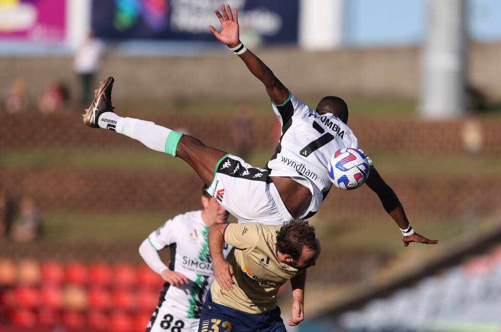 Western United midfielder Tonga Doumbia climbs above Angus Thurgate in the 3-1 win over the Newcastle Jets on Saturday. Picture Getty Images