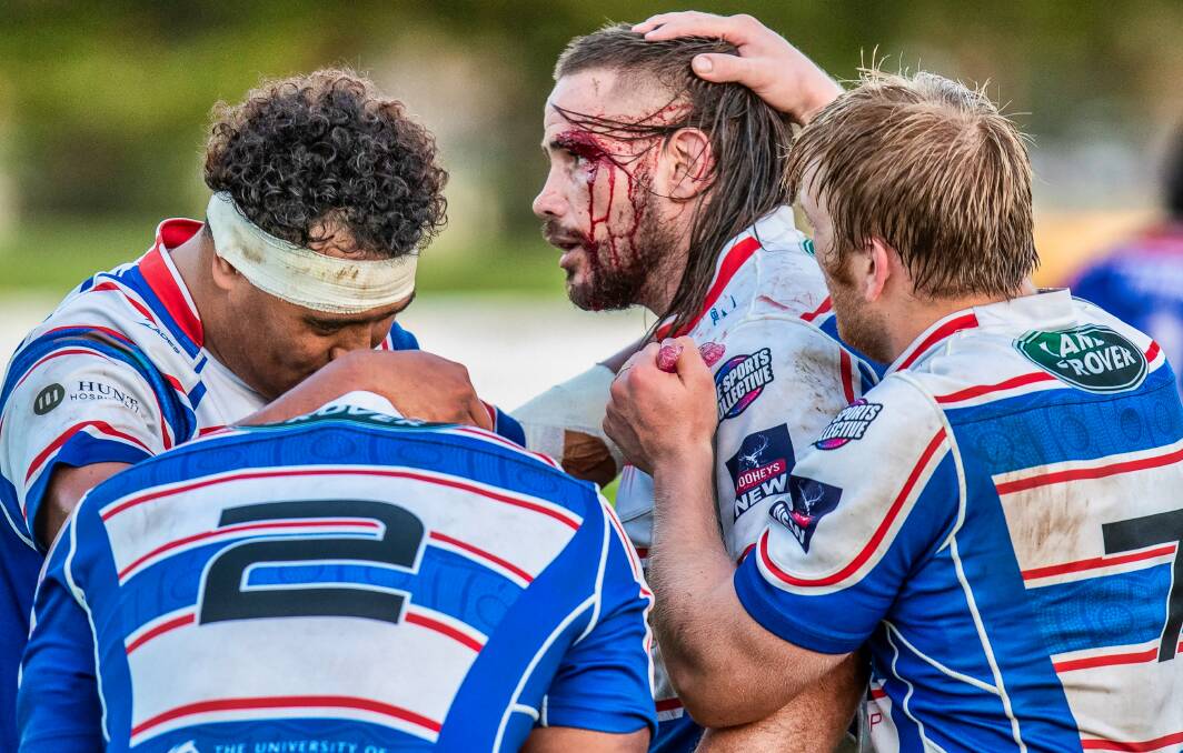 AWESOME: Hunter Wildfires prop Nick Dobson is congratulated by teammates during the 25-21 win over Manly. Picture: Stewart Hazell 