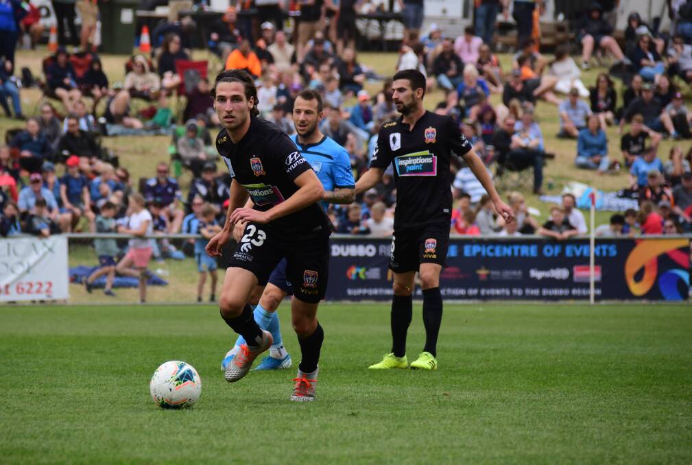 OFF AND RUNNING: Jets midfielder Matthew Ridenton on the ball in the scoreless draw with Sydney FC. Picture: Amy McIntyre