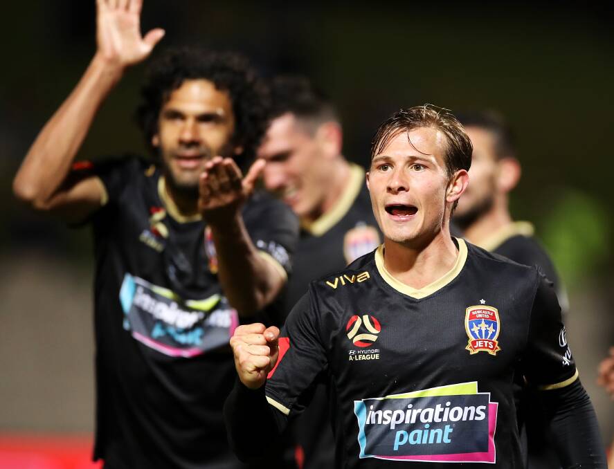 ON TARGET: Nick Fitzgerald celebrates after his goal in the Jets' 2-1 win over Sydney FC on Tuesday night. Picture: Getty Images