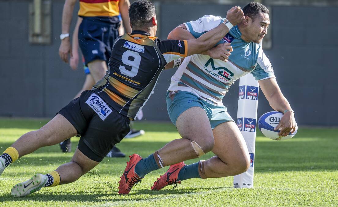 TOO STRONG: Halfback Leon Fukofuka plants the ball down in the corner for the Wildfires' opening try in a 86-10 thrashing of Penrith on Saturday. Picture: Stewart Hazell