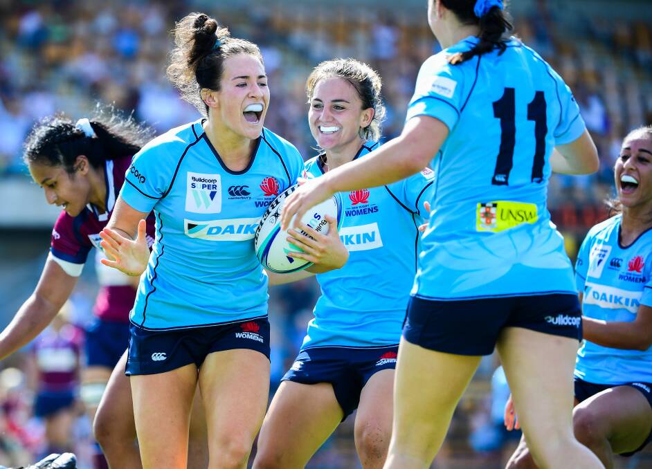 TRY-TIME: Maya Stewart celebrates after touching down for the Waratahs in the 15-12 win over Queensland at Leichhardt Oval on Saturday. Picture: AAP
