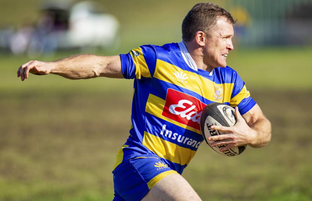 FRESH: Pete Maxwell on the run in the Hawks' win over Nelson Bay. Picture: Stewart Hazell