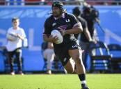 ON THE CHARGE: Andrew Tuala hits the ball up for the Gilitinis against the Utah Warriors in the Major League Rugby clash at the LA Coliseum in March. Picture: Getty Images