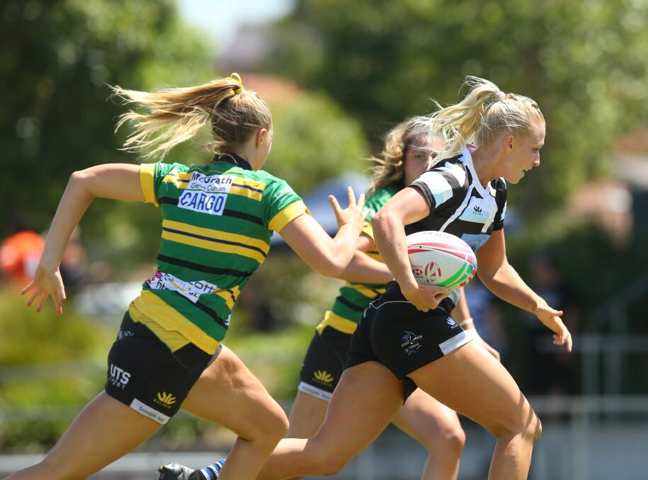 ON THE ATTACK: Nelson Bay's Pippa Smith breaks through the Gordon defence in a pool game of the women's premiers division at the Mick "Whale" Curry Memorial Sevens. Picture: Max Mason-Hubers