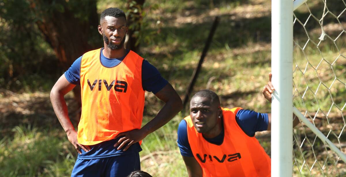 COMPETITION: Bernie Ibini and Abdiel Arroyo at Jets training on Tuesday. Picture: Simone De Peak
