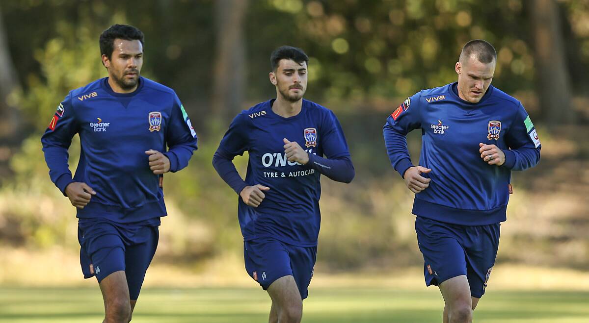 HITTING THE GROUND RUNNING: Nikolai Topor-Stanley, Johnny Koutroumbis and Nigel Boogaard. The Jets resumed training last Wednesday. Picture: Marina Neil