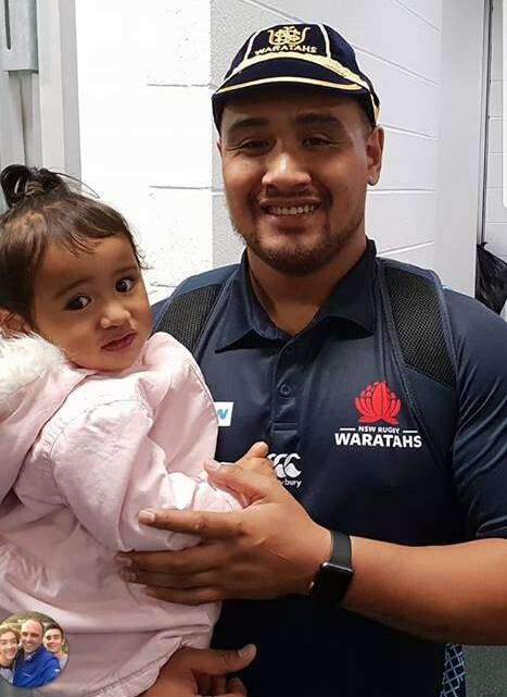 CAPPED: Andrew Tuala and youngest daughter Telesia.