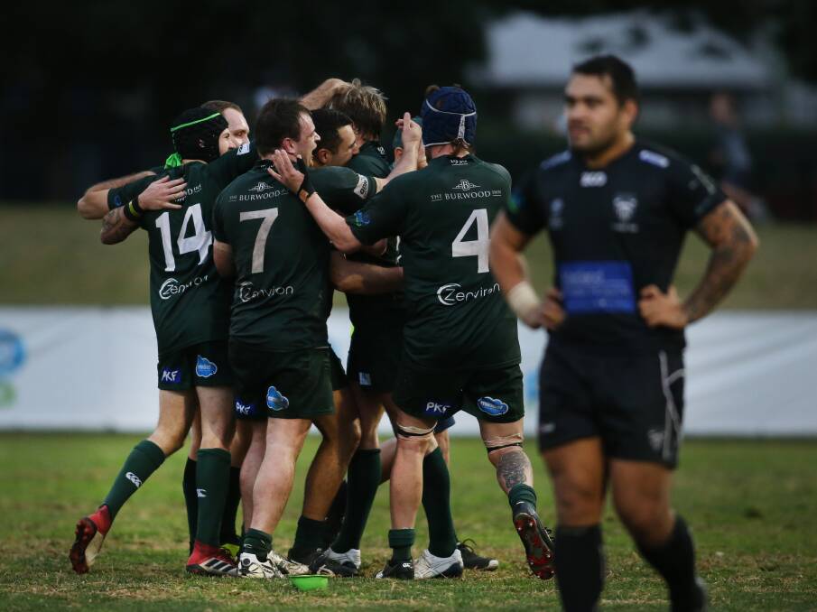 MATCH WINNER: Merewether celebrate after Sam Bright kicked a late penalty to snatch a 31-29 win over Maitland in the qualifying semi-final at No.2 Sportsground on Saturday. Pictures: Marina Neil