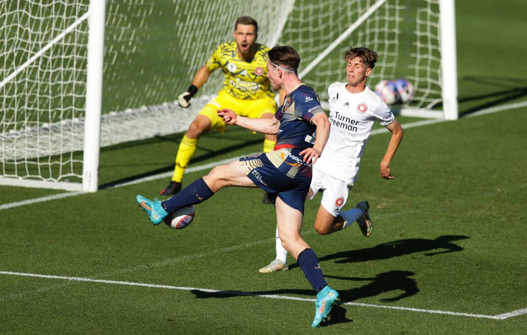 Impressive rookie Clayton Taylor fires a shot during the Jets' 2-all draw with Western Sydney Wanderers at Maitland Sportsground on Friday. Picture by Jonathan Carroll 