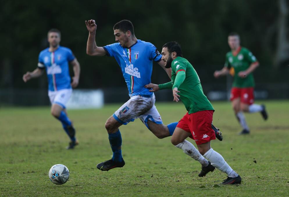 TOUGH SLOG: Azzuri striker Harry Frendo beats Adamstown defender Denis Fajkovic for possession in their 3-all draw at Lisle Carr Oval on Sunday. Picture: Jonathan Carroll