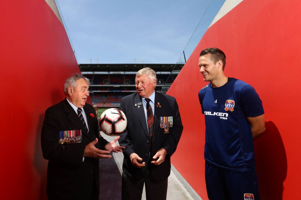 RESPECT: Newcastle RSL sub-branch president Ken Fayle and vice president Stephen Finney with Nigel Boogaard. Picture: Jonathan Carroll