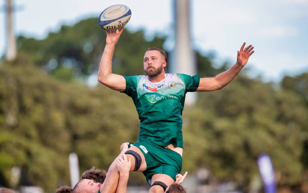 Merewether No.8 Lachy Milton flies high to pull in a lineout ball. The dynamic back-rower has recovered from illness and injury and will be key for the Greens against Hamilton on Saturday. Picture by Stewart Hazell