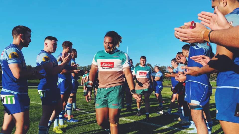 WINNING WALK: The Wildfires are congratulated by Western Sydney after breaking through for their first win in the Shute Shield this season. Picture: Stewart Hazell