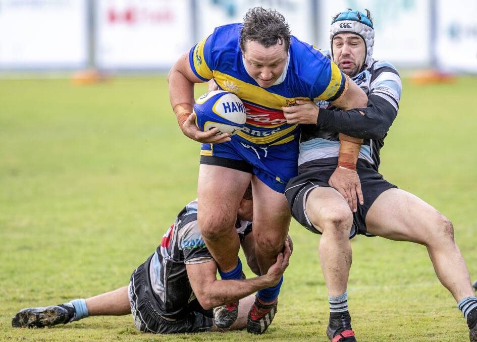 ON THE CHARGE: Nelson Bay fly-half Chad Northcott attempts to pull down powerhouse Hamilton centre Billy Clay at Passmore Oval on Saturday. Picture: Stewart Hazell