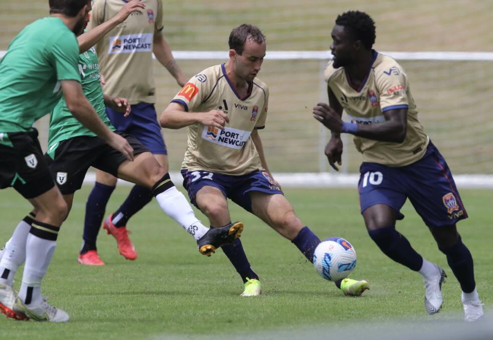 ON THE BALL: Jets midfielder Angus Thurgate threads a pass through traffic in the friendly against Macarthur. Picture: Newcastle Jets